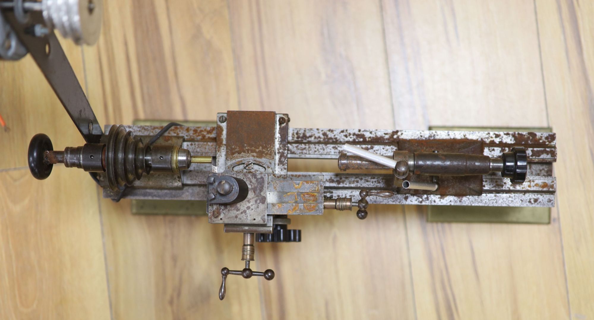 Clockmakers tools - a steel lathe with two brass supports, no makers mark, 44cm, with Fasco motor attachment